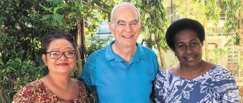 Fr. Frank, with Lilian (left) and Vitalina (right)